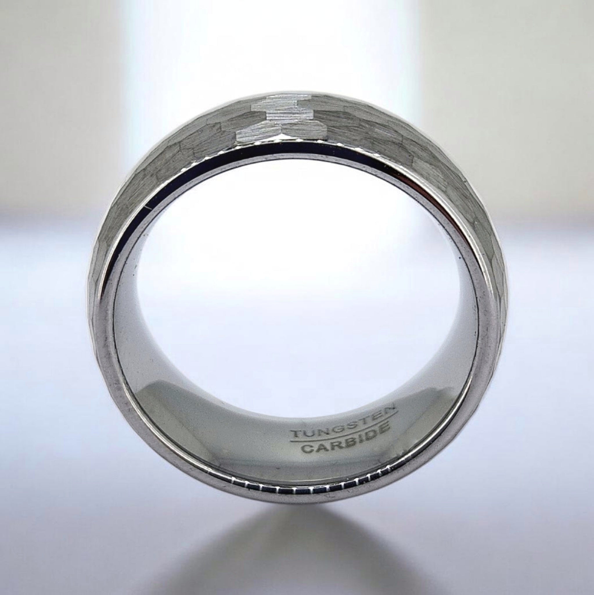 Front view of hammered tungsten ring showing band thickness and surface detail