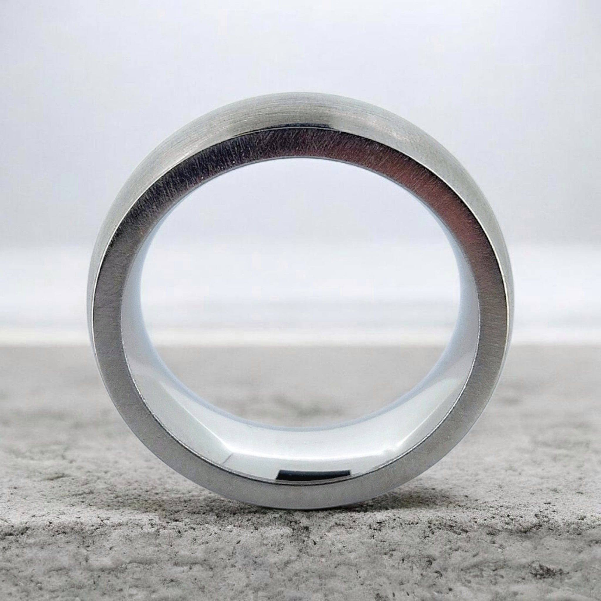 Front view of silver domed tungsten ring showing band thickness and inner profile